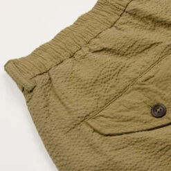 Universal WorksCotton Seersucker Pleated Track Short - Olive 13 Universal WorksCotton Seersucker Pleated Track Short - Olive -Grami Jean Shop Universal Works Pleated Track Short Cotton Seersucker Olive 20230321171137 3